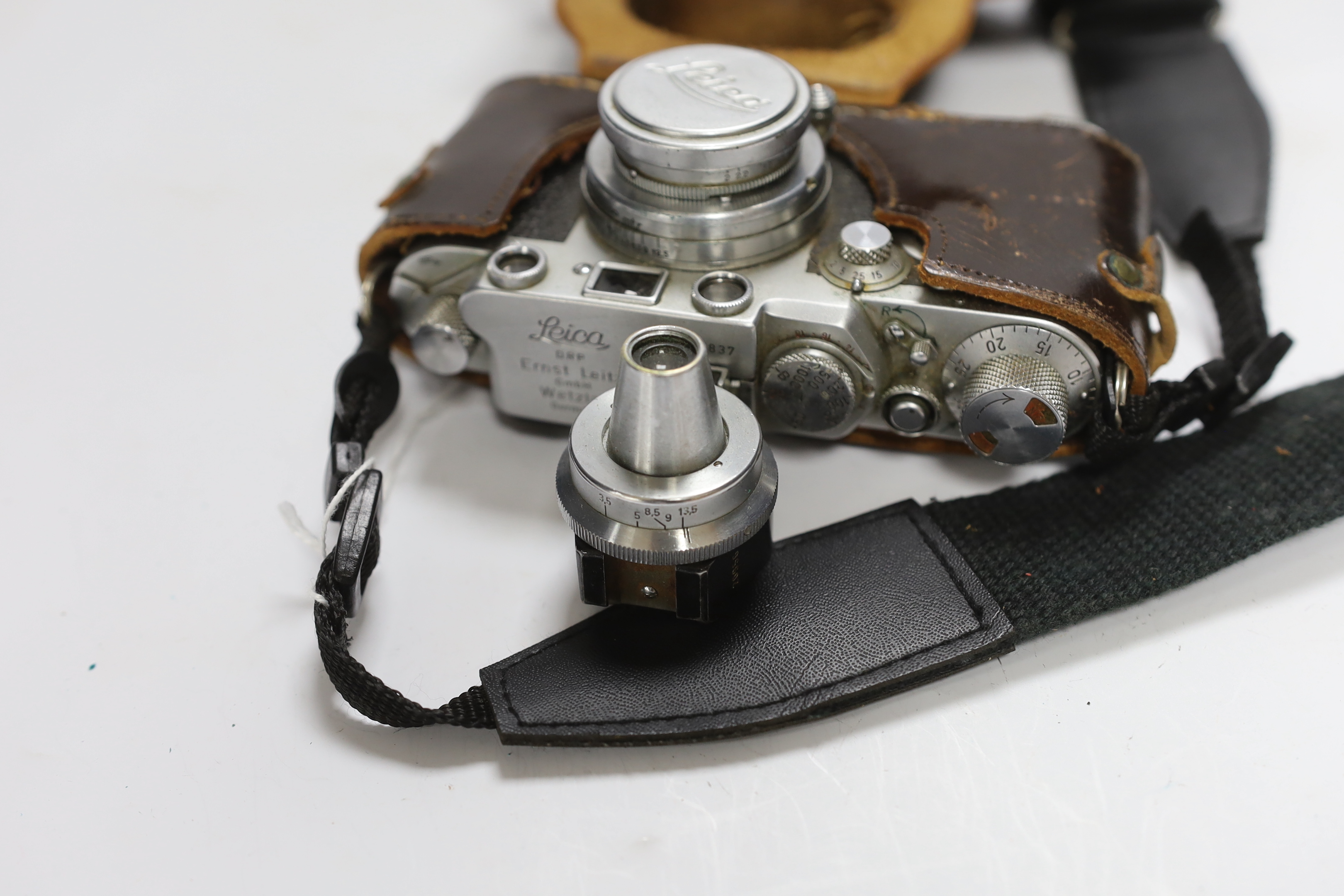 A Leica IIf camera, serial no. 577837, c. 1952-3, with Leitz Vidom viewfinder, Summar f+5cm 1.2 lens, in leather case with replacement strap